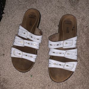 Clarks soft cousin slides.
